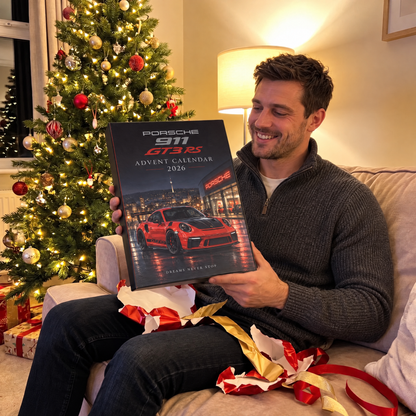 Man opening the Porsche advent calendar as a Christmas gift